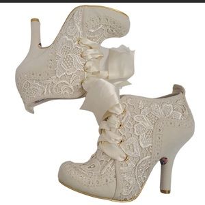 Irregular choice white lace bootie with silk laces.